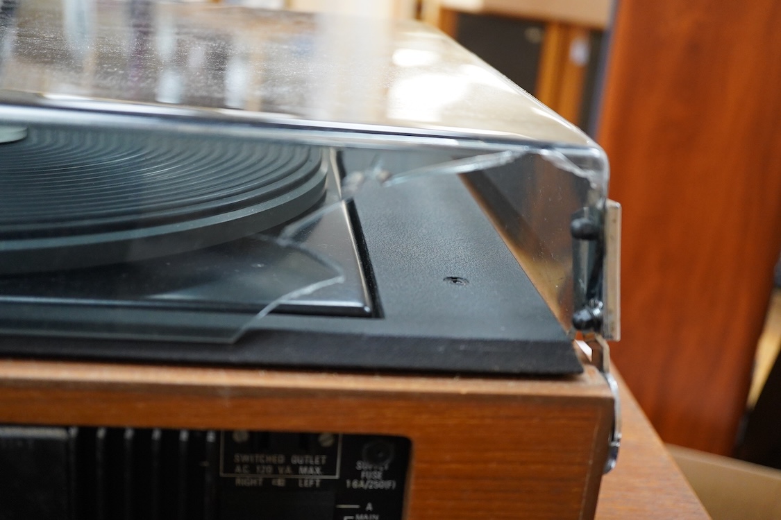 A Dynatron Goldring GL78 turntable with integral amplifier and tuner, made in Switzerland, together with a pair of Leak Sandwich 600 stereo speakers in teak cabinets, 65cm high